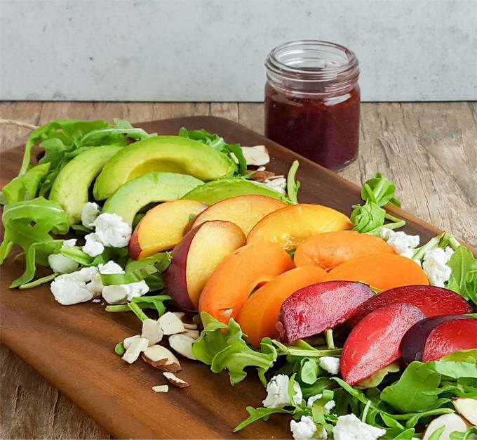 Peach, plum, and apricot salad with blackberry basil dressing. Summer's bounty in a healthy, easy salad. (It's also a fun rainbow salad)