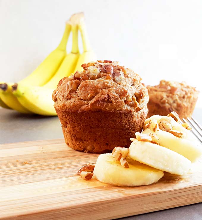 This banana nut muffin recipe replaces butter with peanut butter, milk with almond milk, and reduced sugar. It's a healthy snack recipe or great for breakfast. Vegetarian and dairy free.