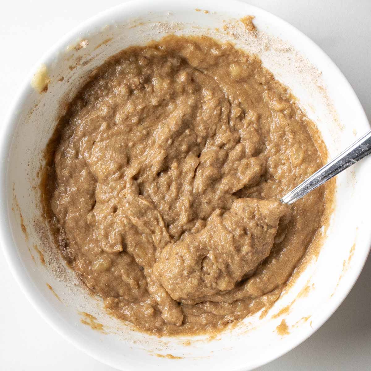 Peanut butter banana muffin batter resting so the whole wheat flour can hydrate. It's still a relatively thick batter.