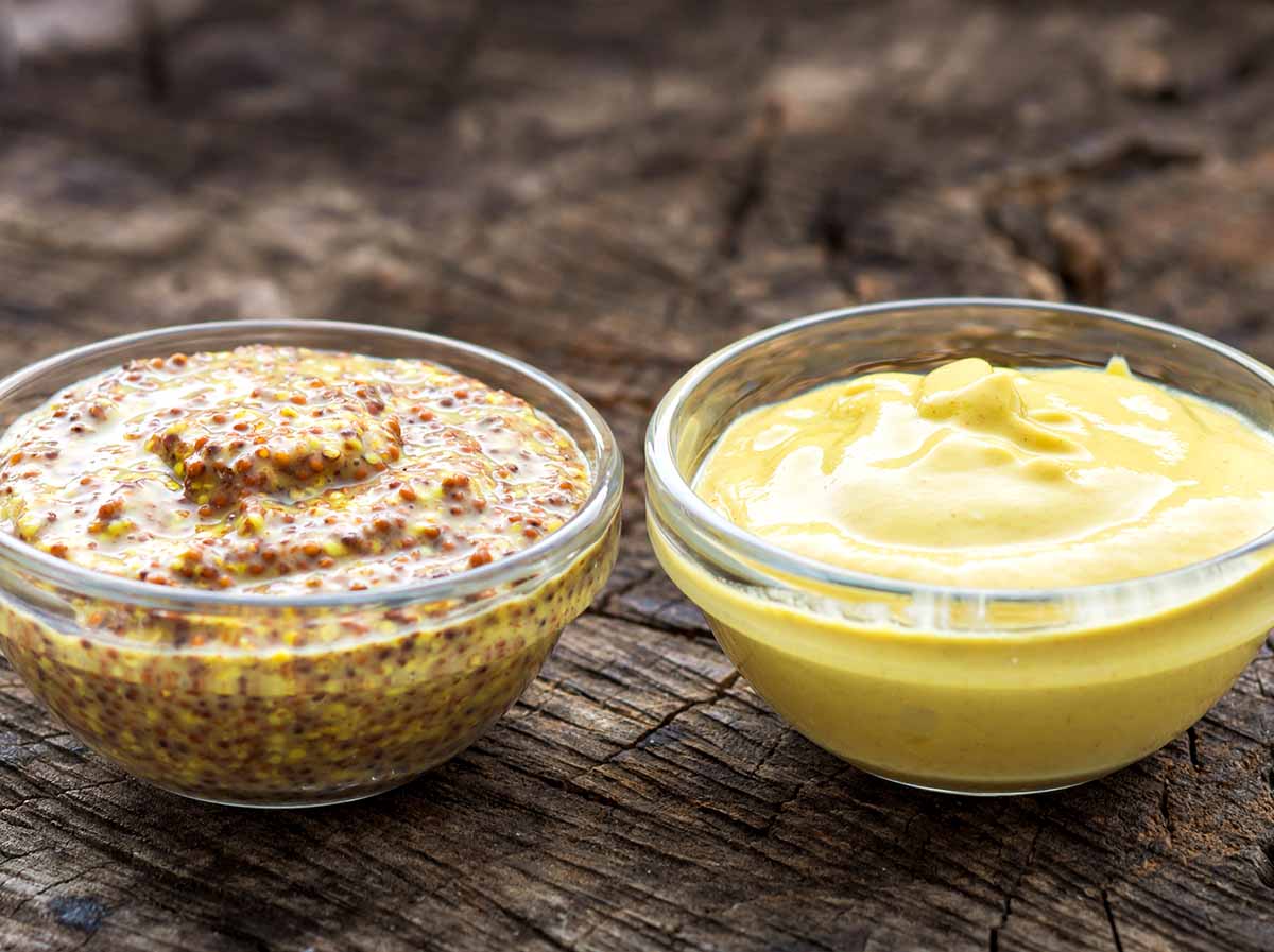 Two types of mustard used for salad dressings: stone ground and Dijon mustard