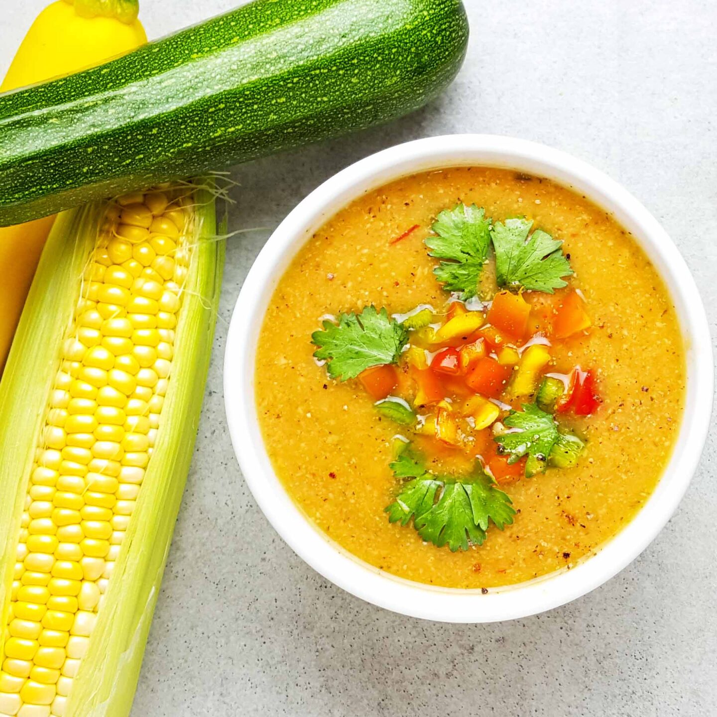 A bowl of southwest zucchini soup with corn