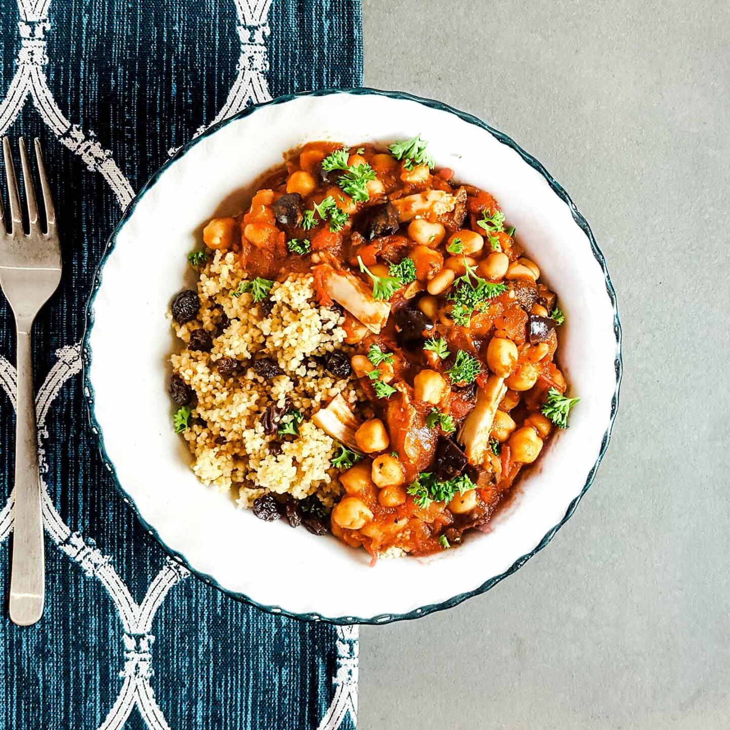 Moroccan chicken stew with olives, over couscous with cinnamon and oranges.