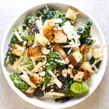 Winter Caesar salad with kale, celery root, hazelnuts, and homemade croutons.