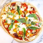A pizza with homemade dough that only takes 15 minutes to make.