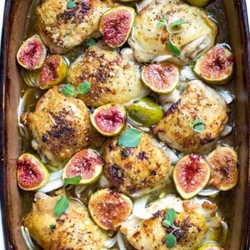 A pan of chicken thighs with figs