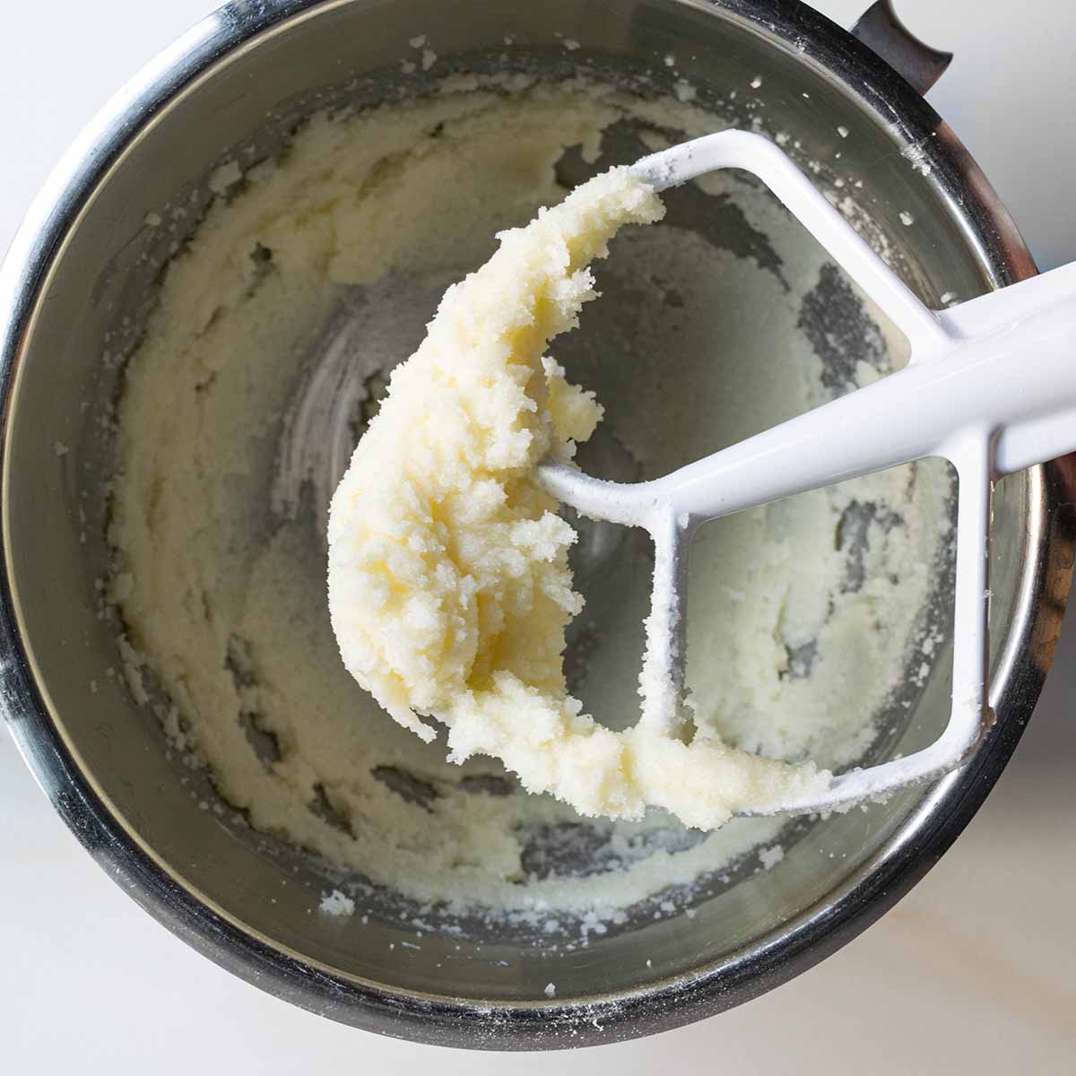 Creamed butter and sugar in a stand mixer - the first step to make a soft & fluffy muffin