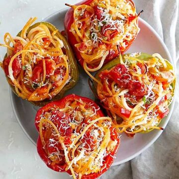 Bell pepers stuffed with spaghetti. Recipe by It's a Veg World
