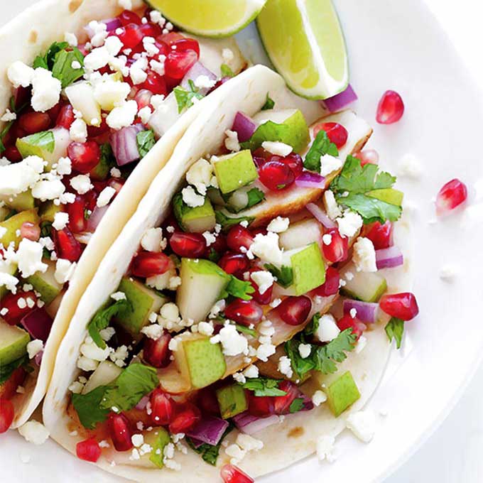 Tacos with pears and pomegranate seeds. Recipe by Gimme Some Oven.