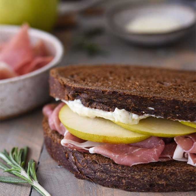 Rye bread sandwich with pears and prosciutto. Recipe by Foxes Love Lemons.