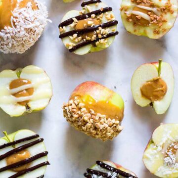 Apples cut in half and stuffed with caramel. Recipe by The Girl on Bloor