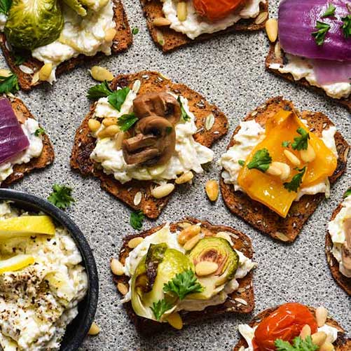 Crackers topped with roasted veggies, recipe by Foxes Love Lemons