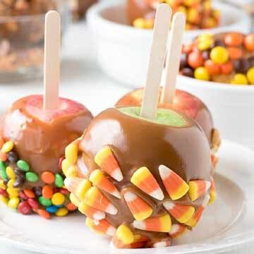Candy coated caramel apples for Halloween, recipe by Boulder Locavore