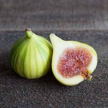 A tiger stripe fig cut in half