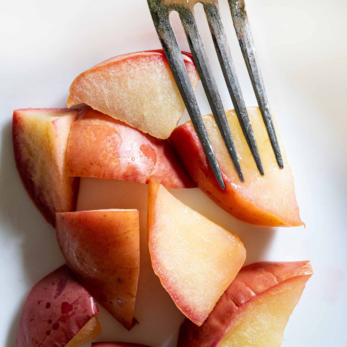 Braeburn apple slices after baking in an apple pie test. It retains the sweet-tart flavor and the slices are very firm.