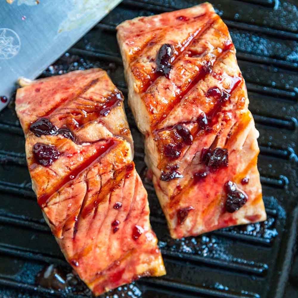 Two salmon filets on the grilled glazed with cherries, recipe from Kevin is Cooking