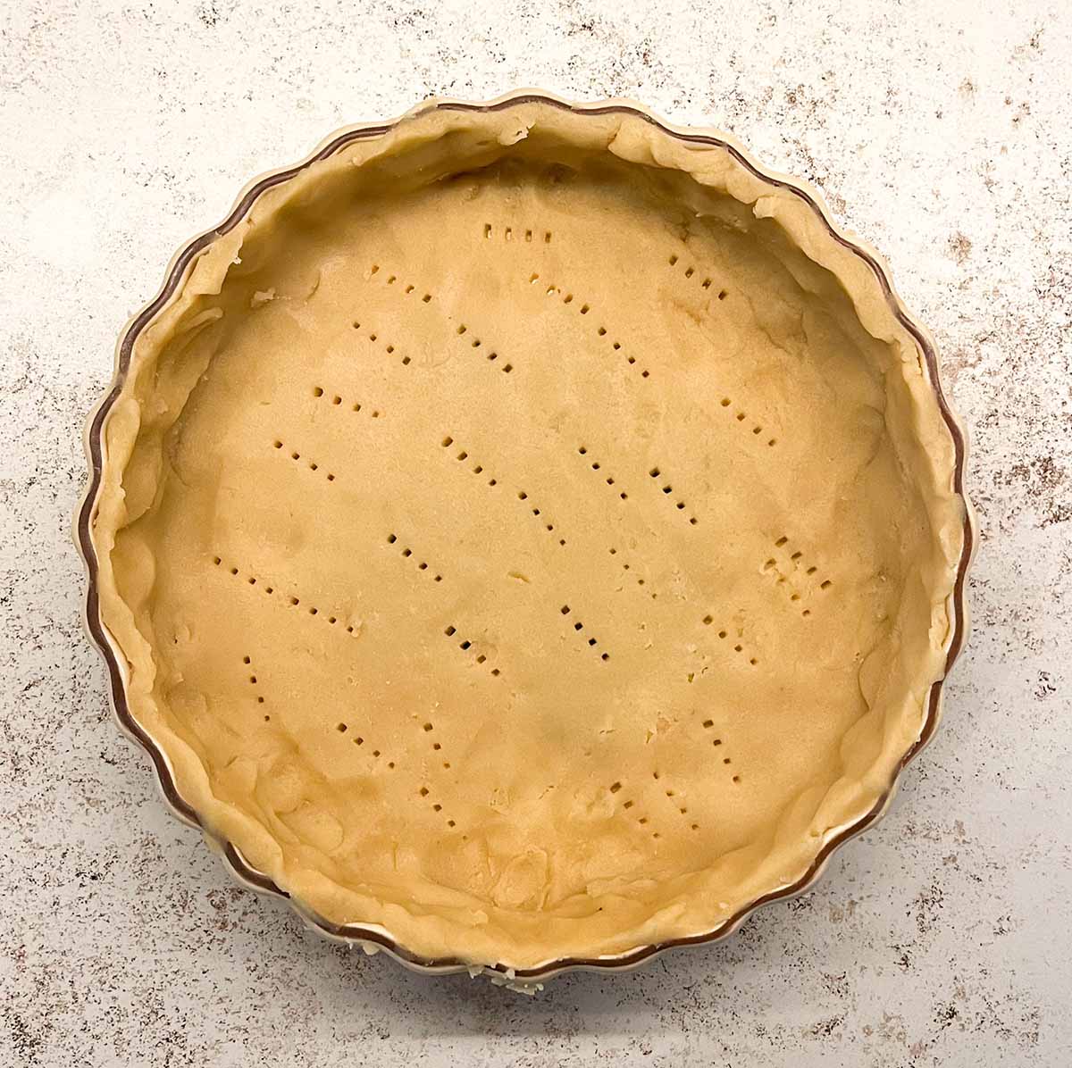 A french style tart dough before it is baked