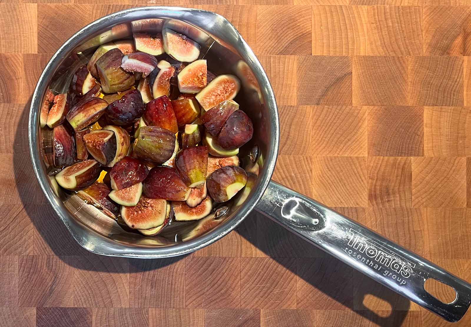 A pot of fresh figs and maple syrup for simmering the filling