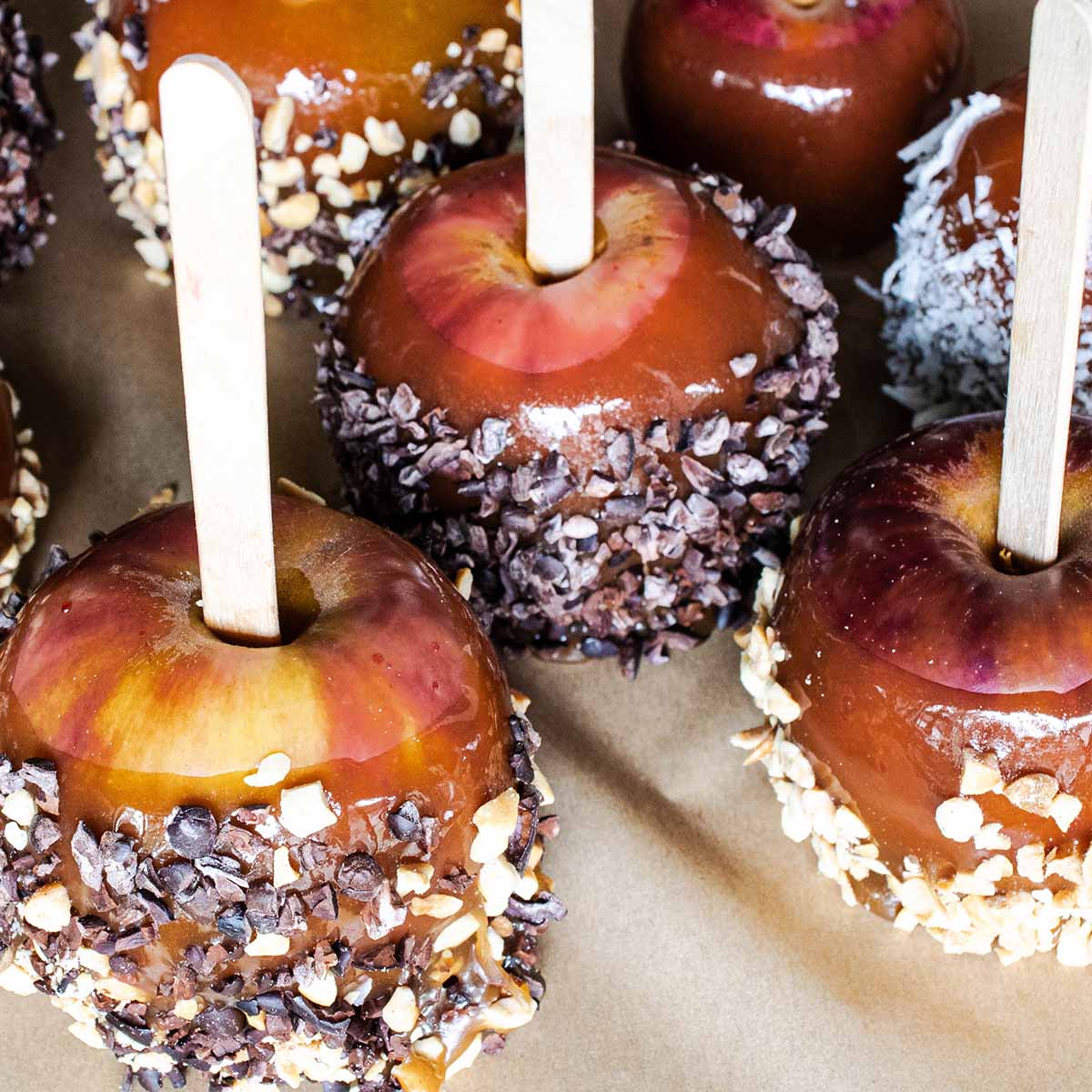 Store caramel apples in the fridge on greased wax or parchment paper.