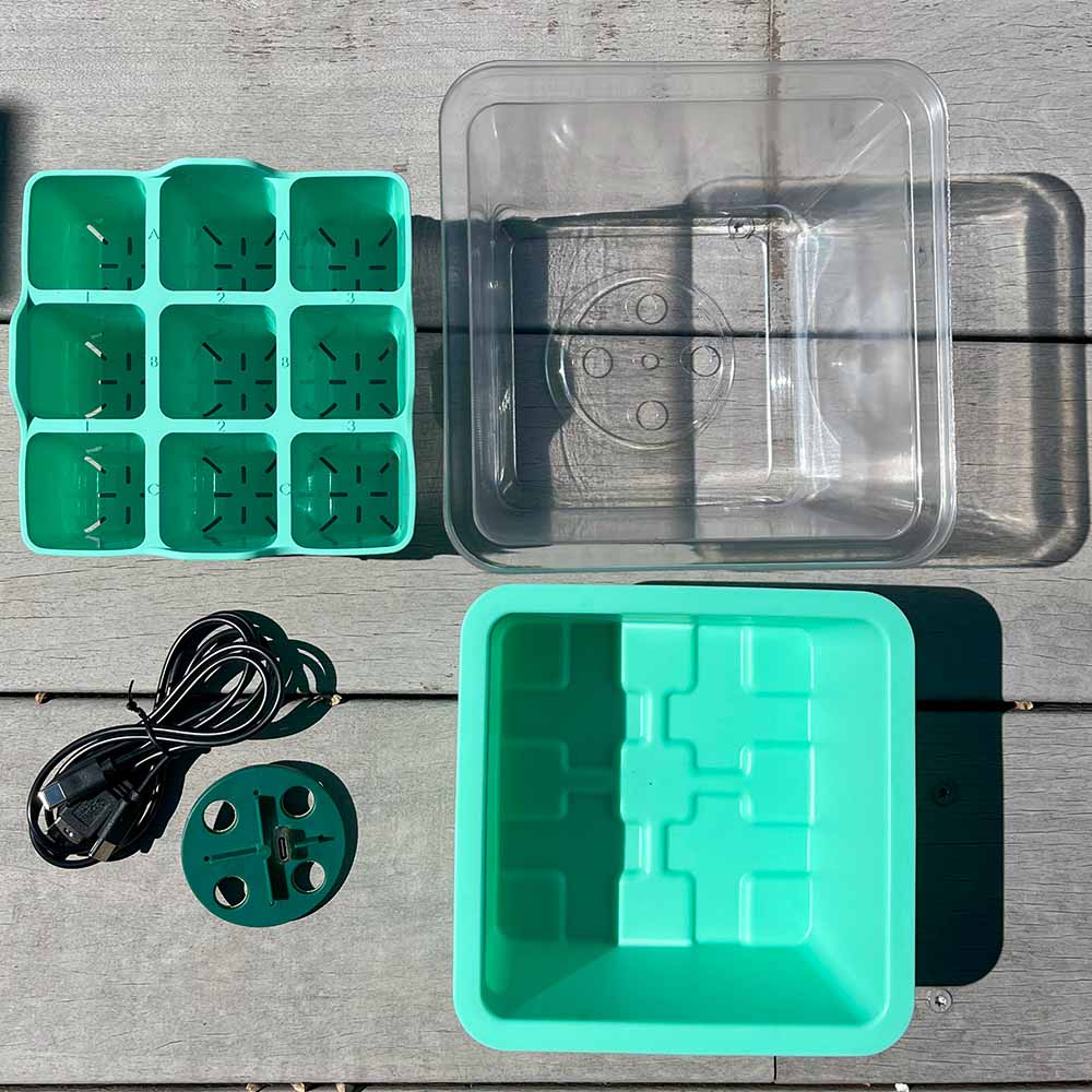 Silicon seed starting kit with 9-cell tray, humidity dome, mini grow light, and usb cable.