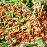 Green bean casserole with fresh green beans, topped with fried onions