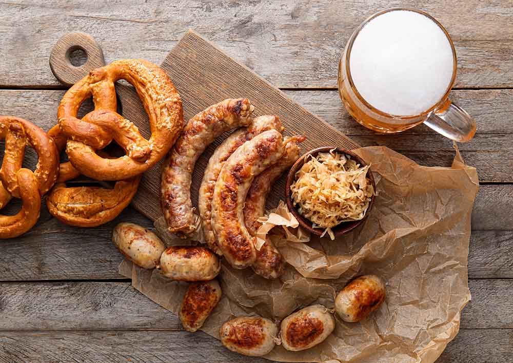 Octoberfest food and sides with a beer on a table