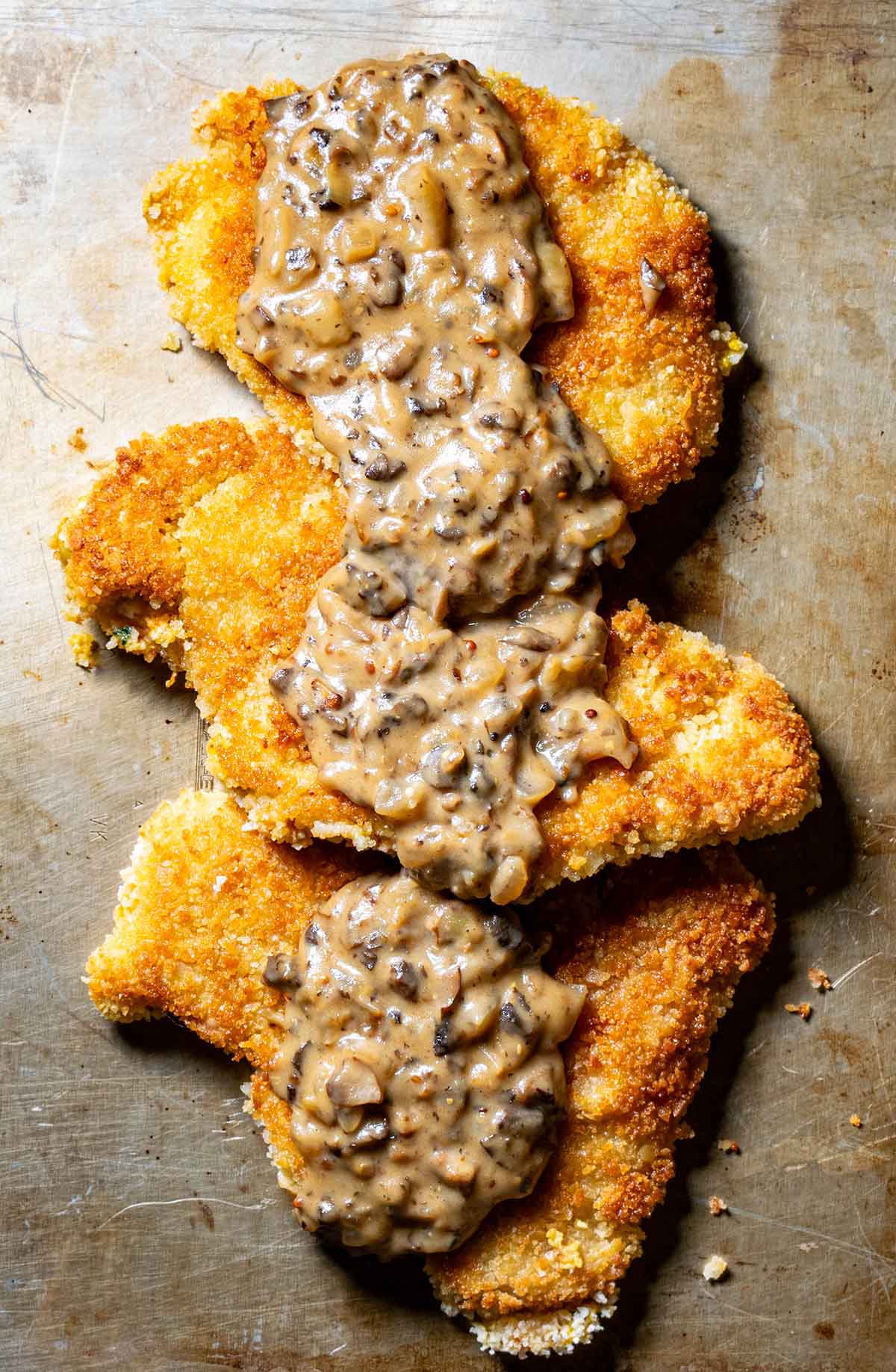 Jagerschnitzel recipe for Oktoberfest, featuring breaded pork chops and a mushroom gravy.