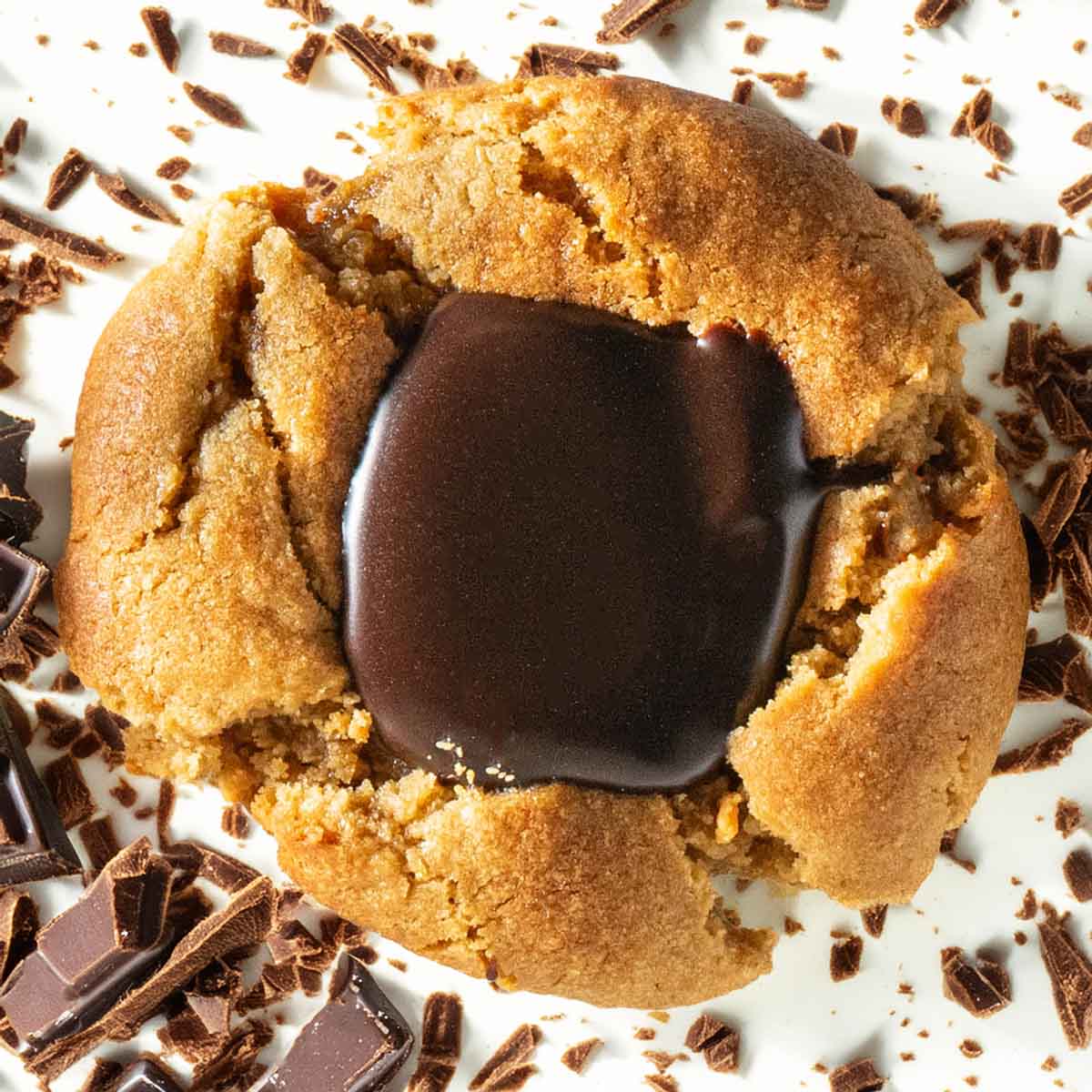 A recipe for soft and chewy peanut butter blossom cookies.