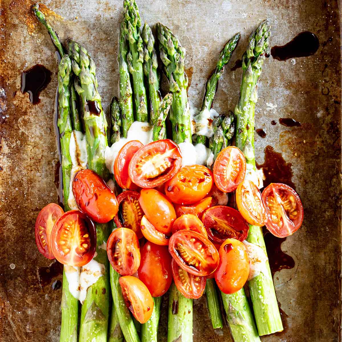 Caprese asparagus salad with fresh tomatoes in early summer