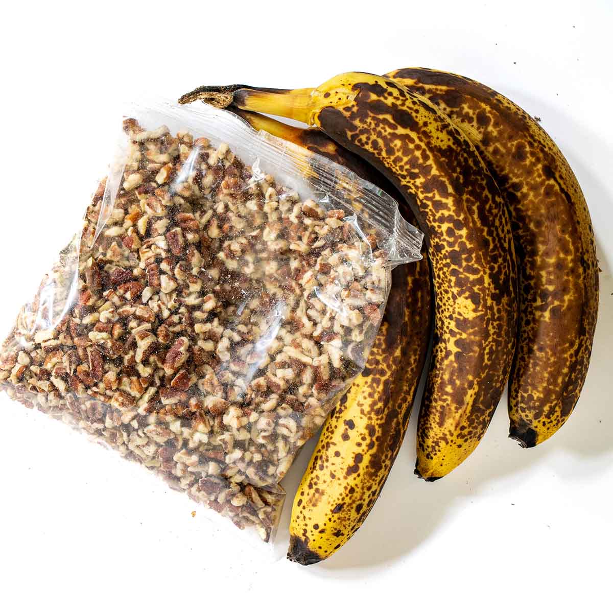 Ripe bananas and chopped pecans - ingredients for banana pecan muffins
