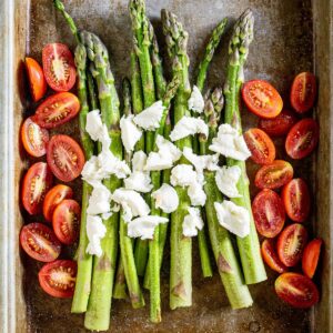 Roasted asparagus with tomatoes for a summer salad