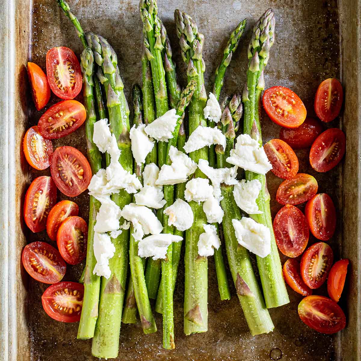 Roasted asparagus with tomatoes for a summer salad