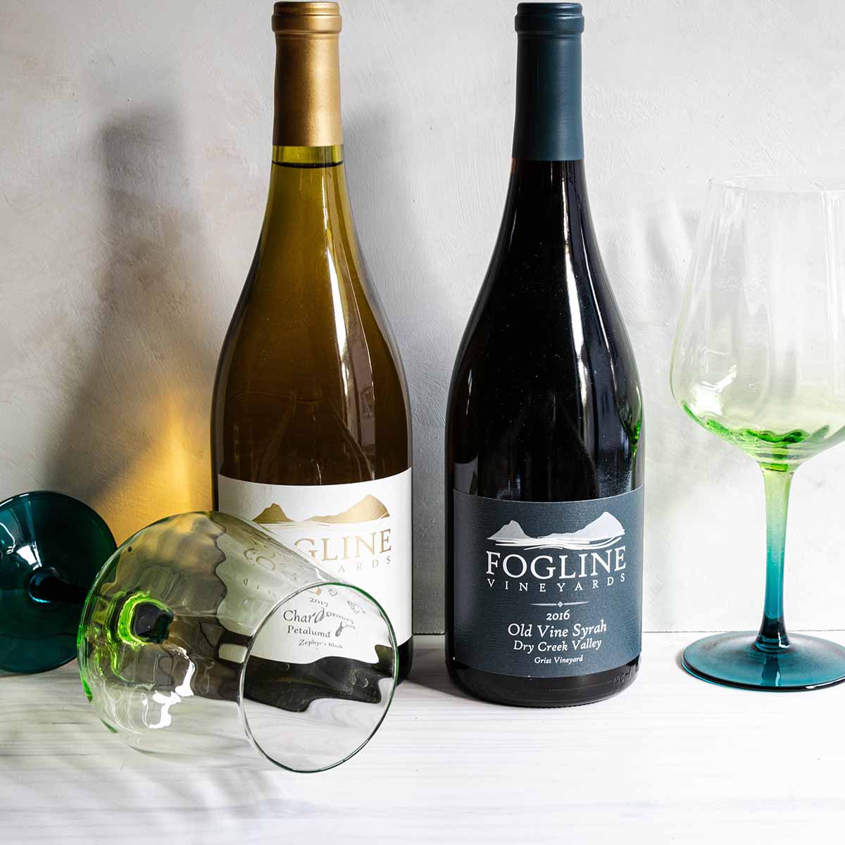 Friendsgiving wine to pair with dinner. A bottle of Chardonnay and a bottle of Old Vine Syrah.