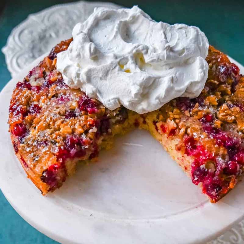 A Nantucket cranberry pie with a slice removed. Recipe by Modern Honey.