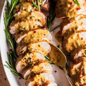 Friendsgiving recipe for roast pork tenderloin with mustard cream sauce, by Sweet Tea and Thyme.