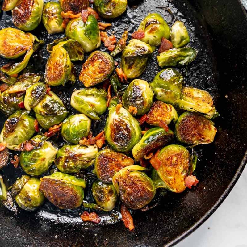 A pan of brussels sprouts with bacon and maple glaze, by Barefoot In The Pines.
