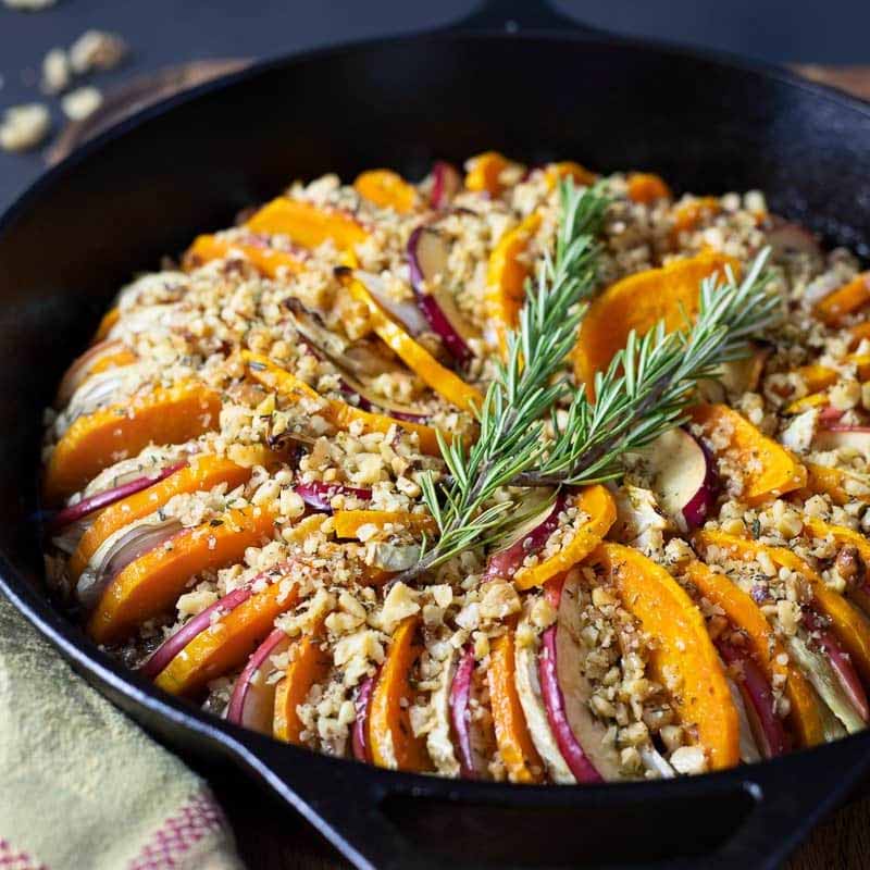 A cast iron pan with butternut squash, apple, and fennel tian by Parsley & Parm.