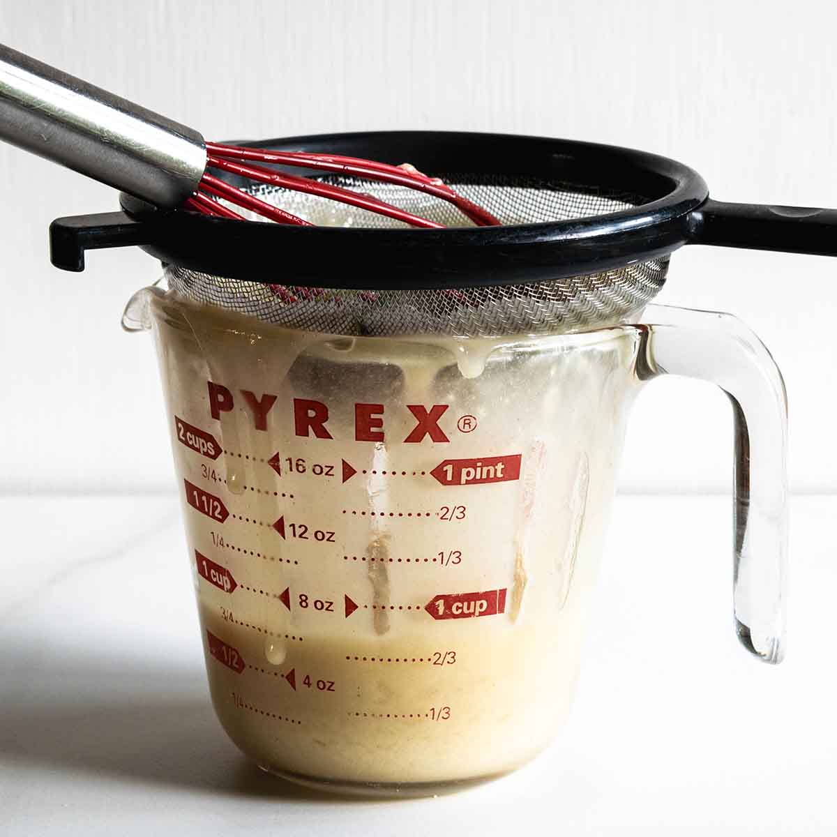 Fixing a lumpy turkey gravy through a fine mesh strainer