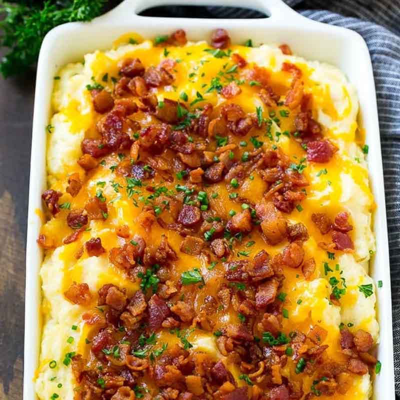 A mashed potato casserole topped with cheese and bacon, from Dinner At The Zoo.