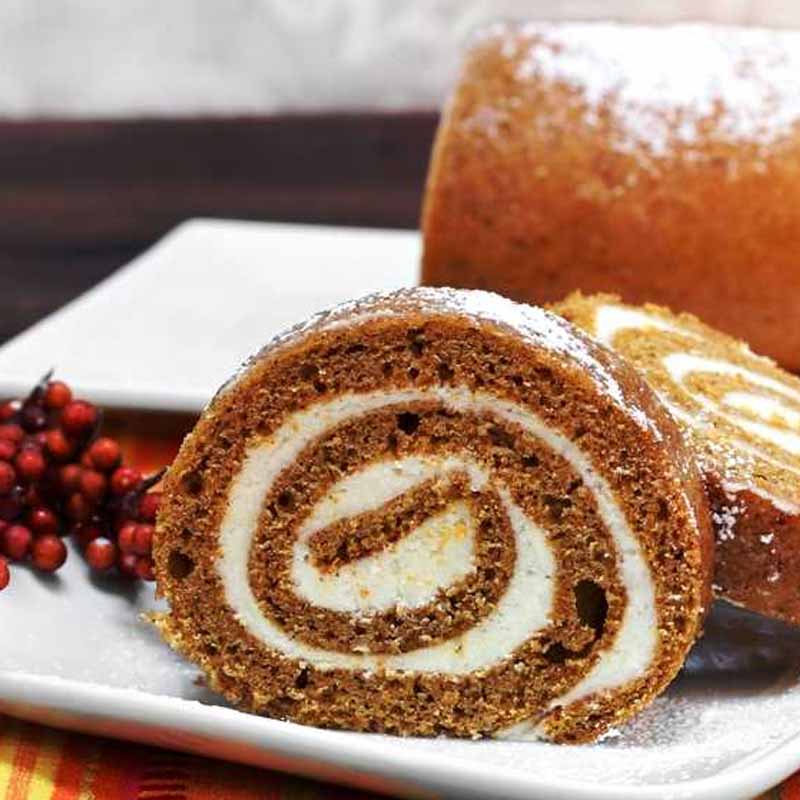 A pumpkin roll with cream cheese frosting in the center. Recipe from Corrie Cooks.