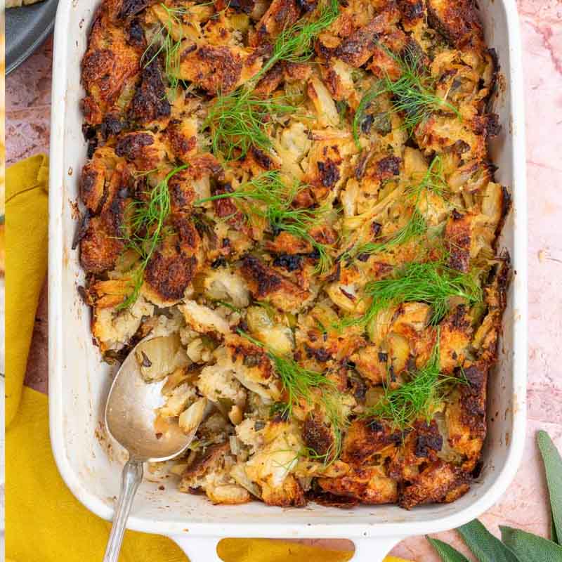 A dish of baked sourdough and fennel stuffing topped with fennel fronds. Recipe from Sourdough Brandon.