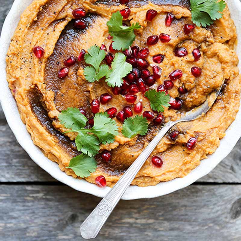 Sweet potatoes topped with a coffee glaze and pomegranates. Recipe by Floating Kitchen.