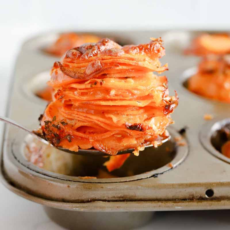 A recipe you can bring to Friendsgiving: muffin tin filled with sweet potato stacks. Recipe by The Darling Apron.