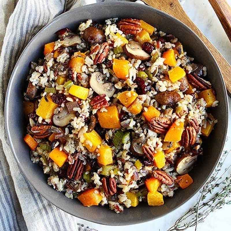 A bowl of wild rice stuffing from Two Peas & Their Pod