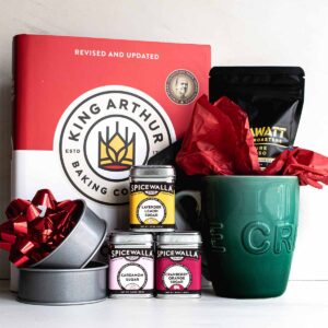 Gifts for bakers: make a kit that includes a cookbook, flavored sugar, a mug, specialty coffee, and english muffin rings for baking her own at home.