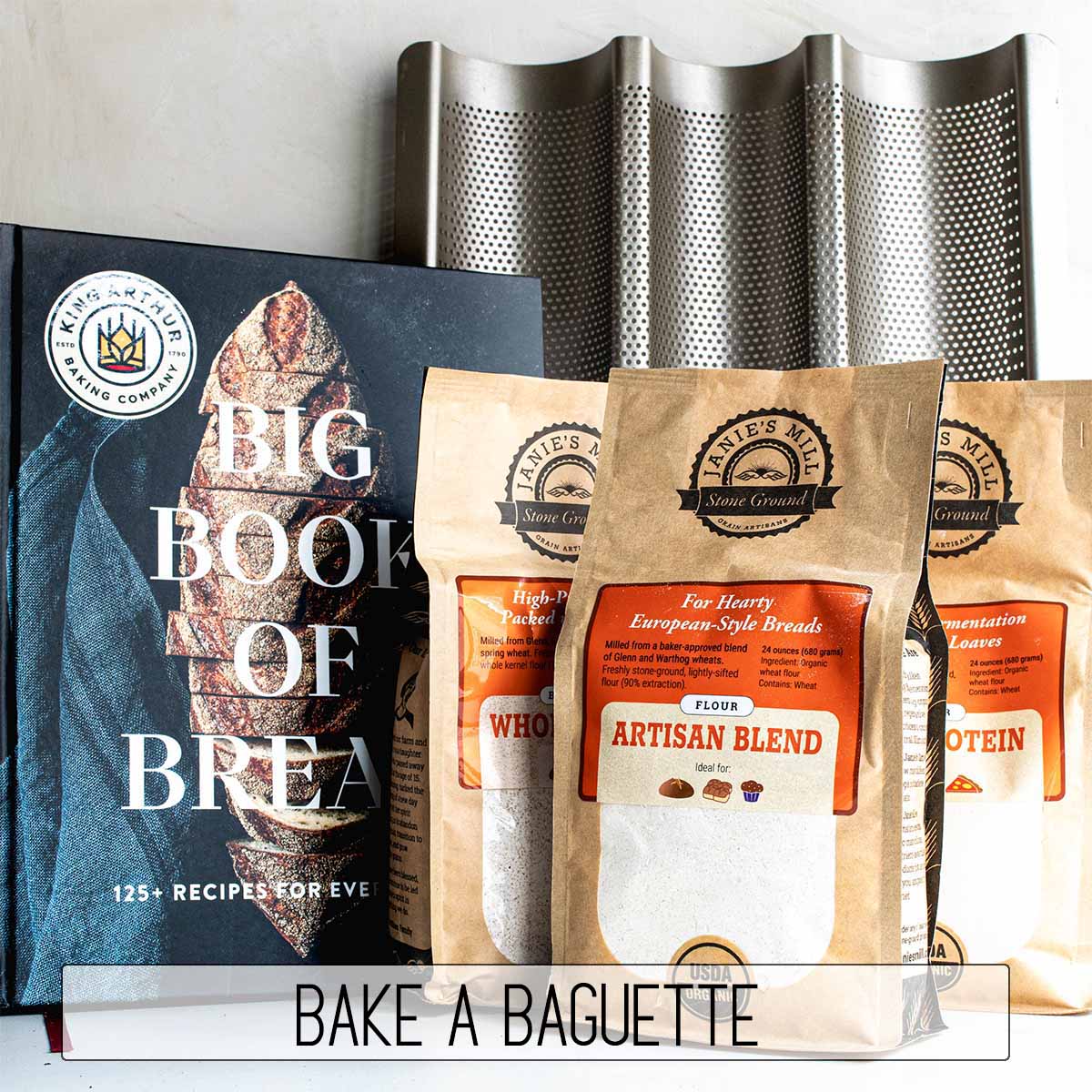 A gift kit for a baker who has everything: a specialty cookbook, pan, and flours to make baguettes.