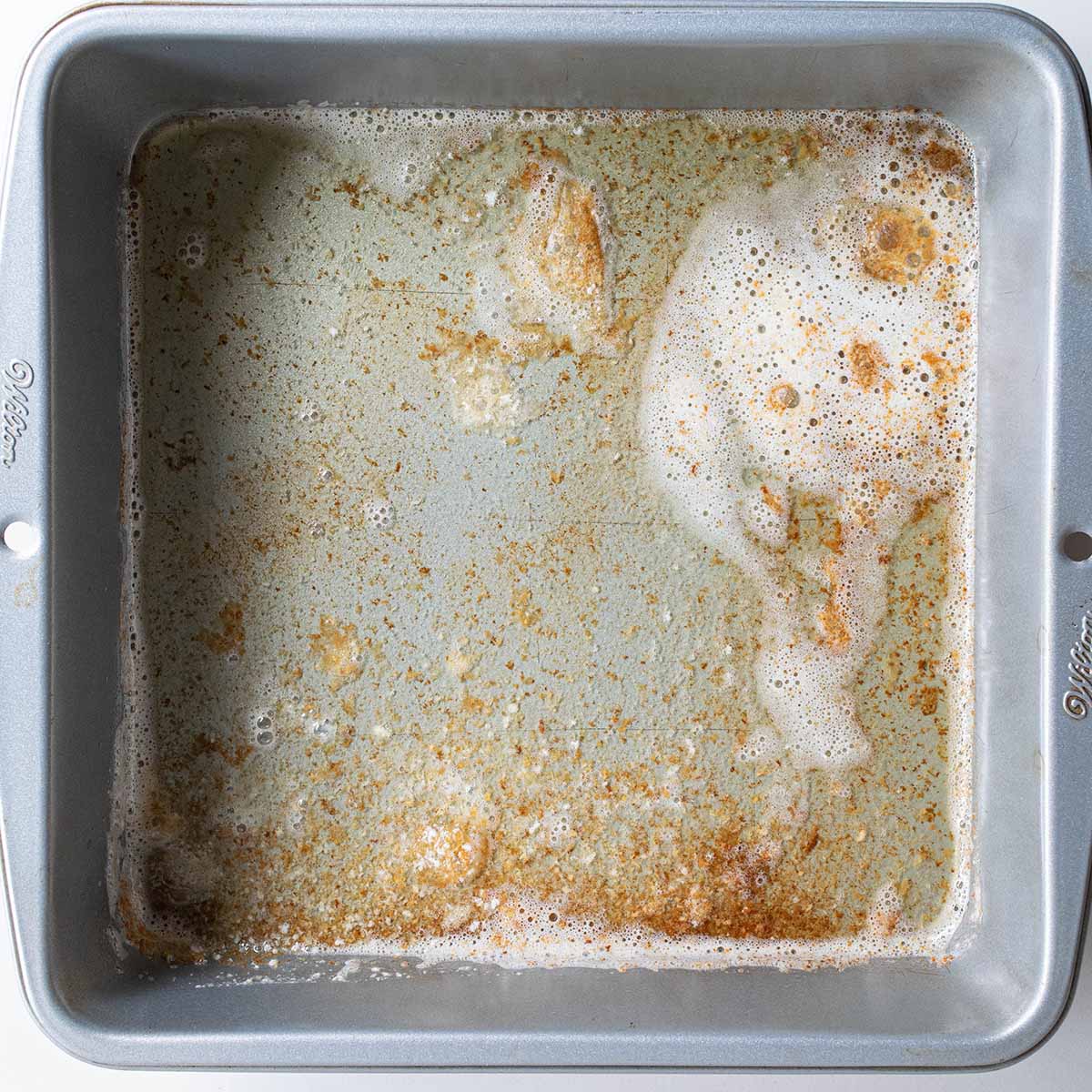 Browned butter in a pan, step one for making a cherry cobbler.