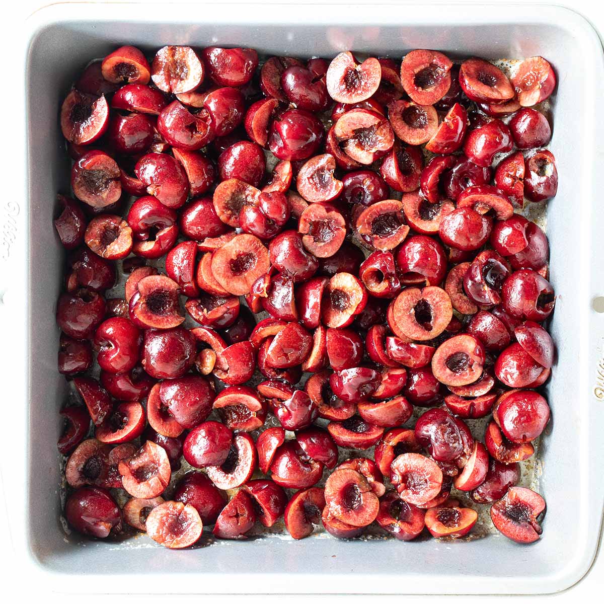 Fresh cherries added to the pan before baking the cherry cobbler