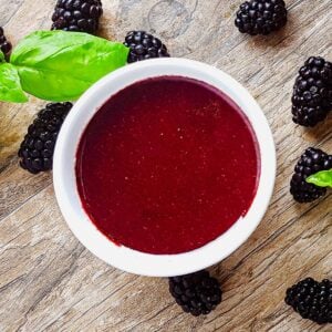 Blackberry vinaigrette salad dressing with fresh blackberries and basil.