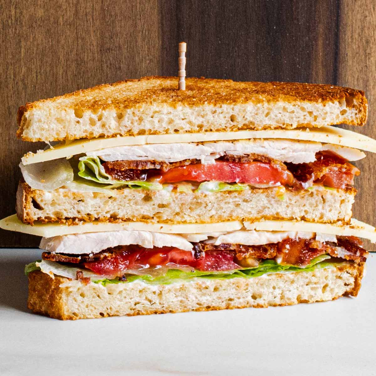 Chicken club sandwich with bacon and cheese (double decker, 3 pieces of bread).