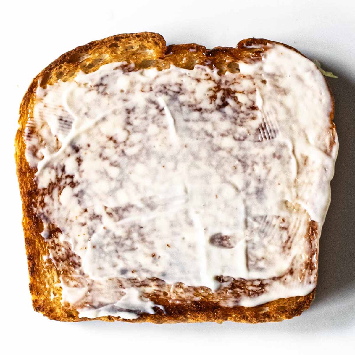 Club sandwich layer 1: mayo on toast.